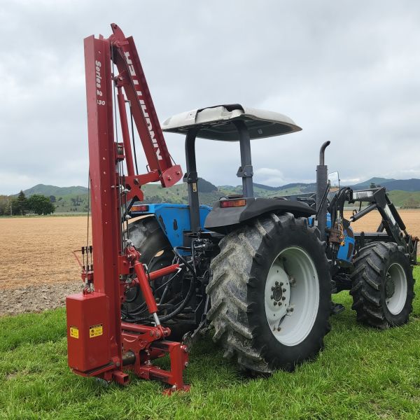 King Country Base on tractor with chainsaw mount between wheels and forks for fence posts