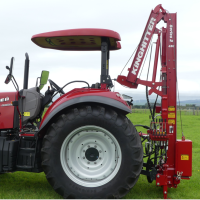 compact post rammer directly behind tractor with hydraulic hinge heavy duty mast