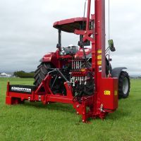 King Country Base on tractor with chainsaw mount between wheels