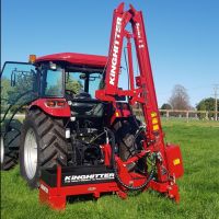 Dairy Donger model Series 1 with 4.3 metre mast hinged over in transport position on CASE tractor in paddock